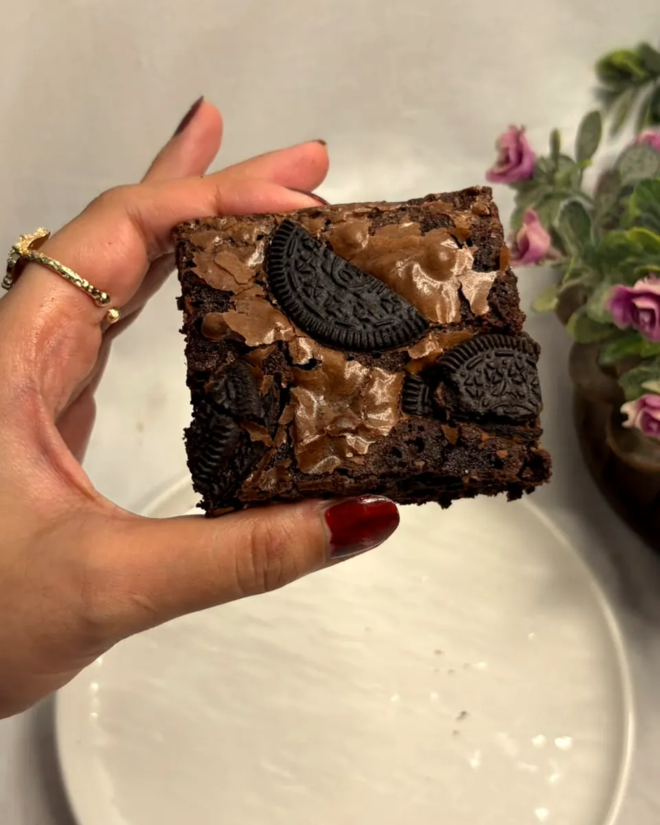 An Oreo brownie held up close